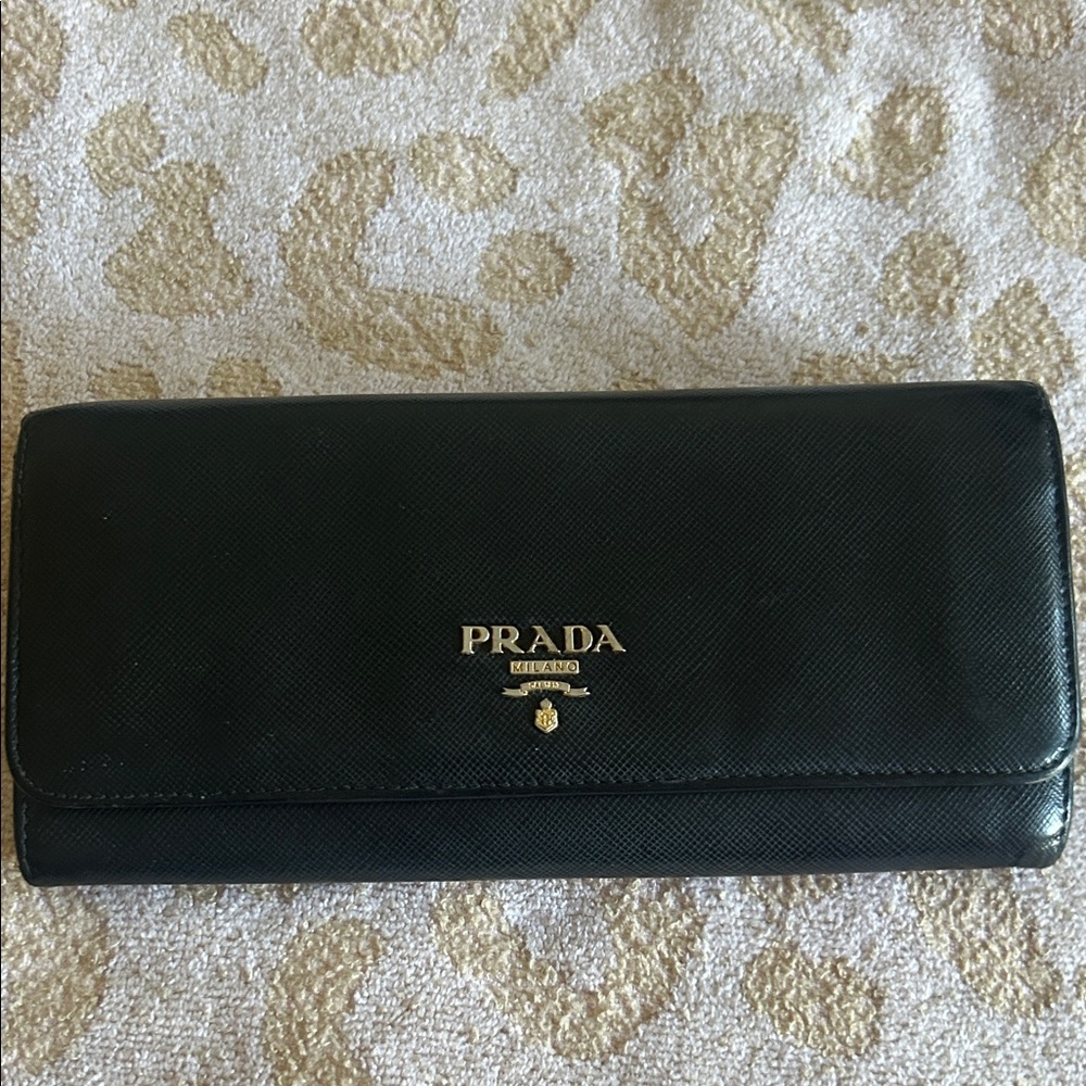 Pre-loved PRADA Black Saffiano leather fwallet with gold finish PRADA lettering